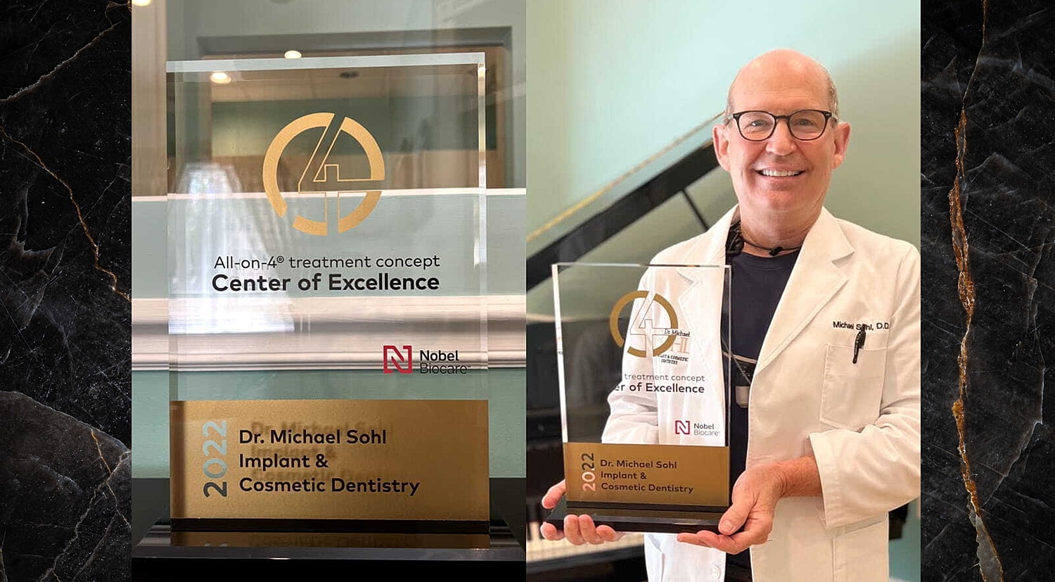 Dr. Michael Sohl with dental excellence award.