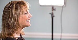 Smiling woman in profile with soft lighting