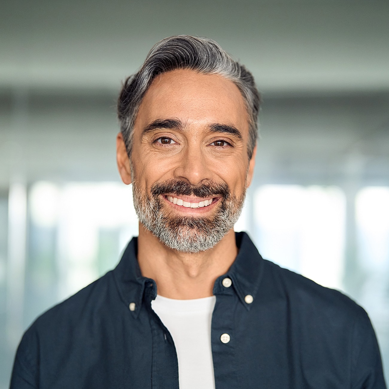 Smiling middle-aged man in casual clothing