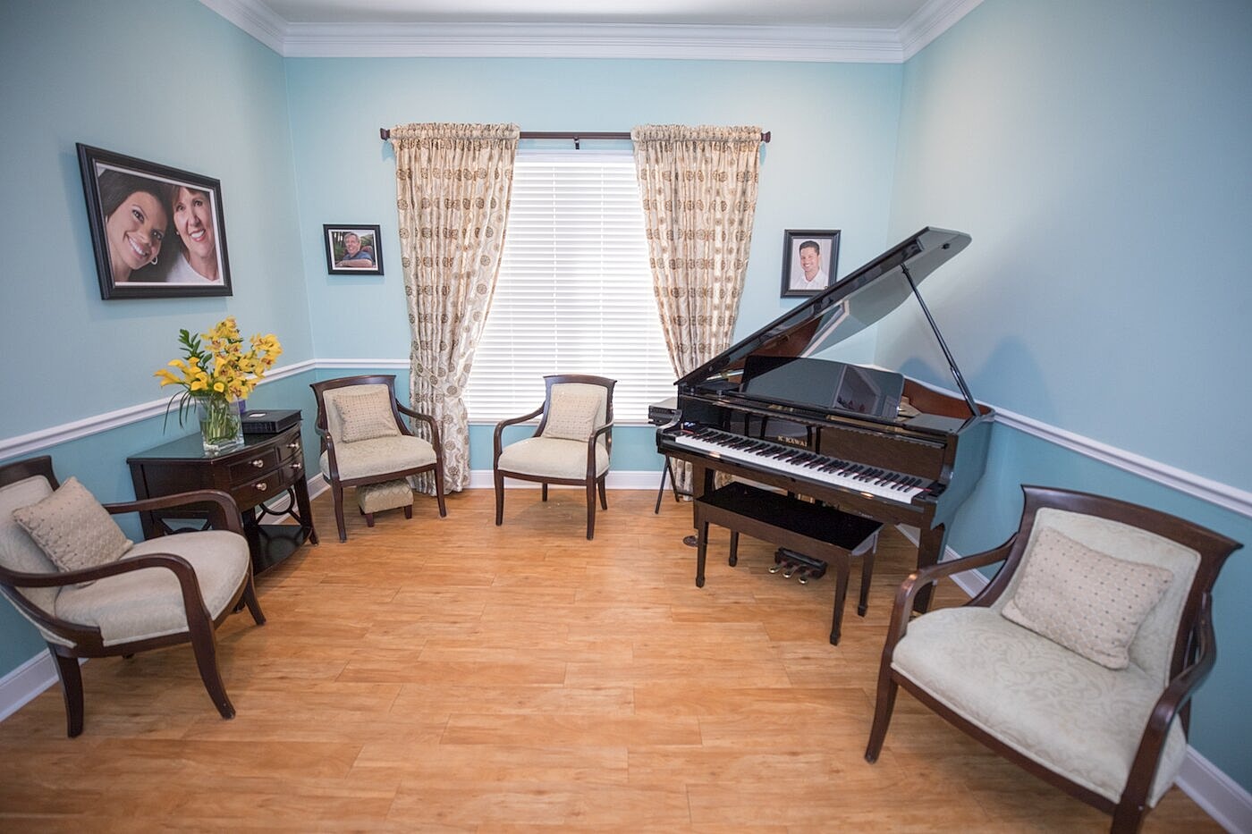 Cozy room with piano and seating area.