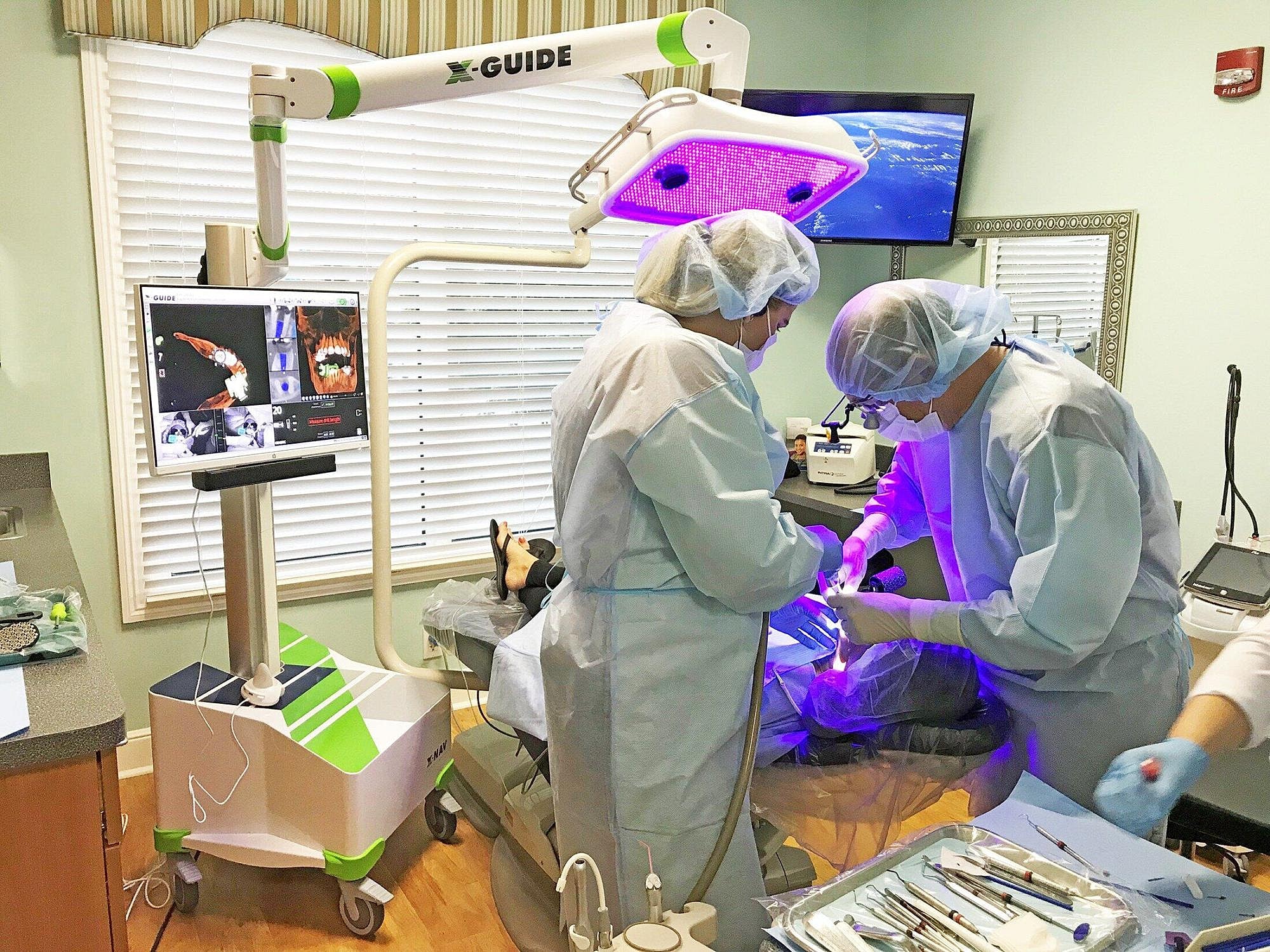 Dental surgery being performed with advanced technology.