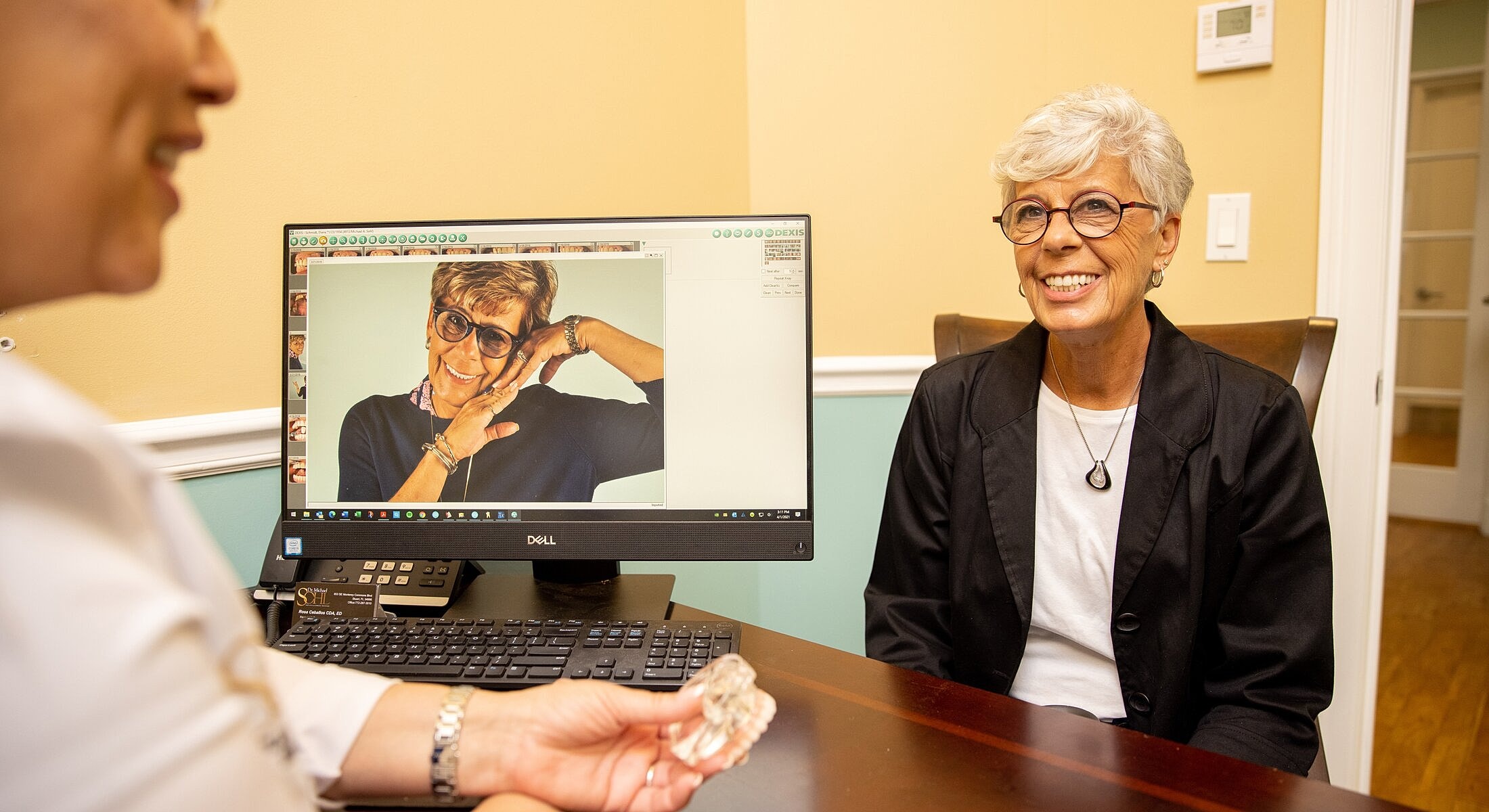 Smiling doctor in a dental or medical office.