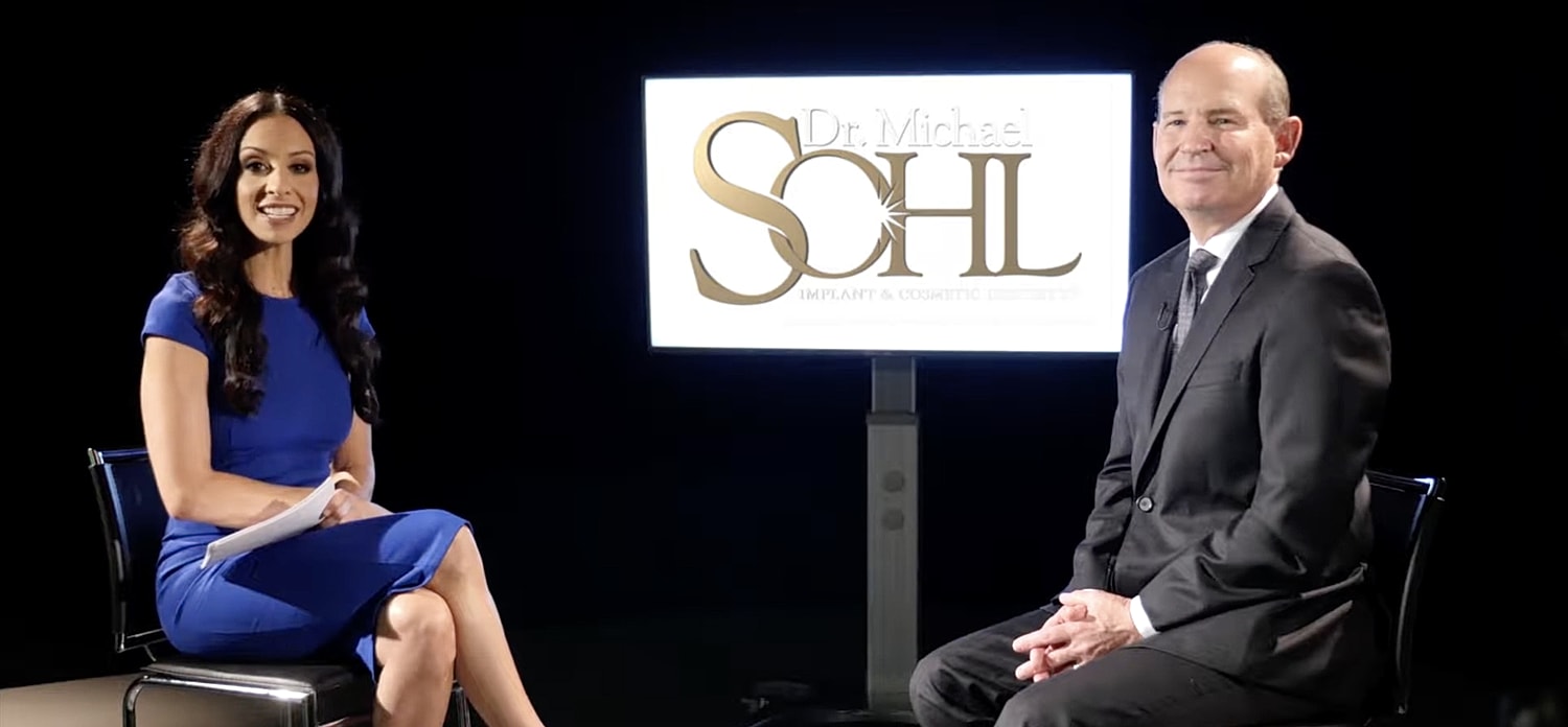 Dentist smiling in a modern dental office.